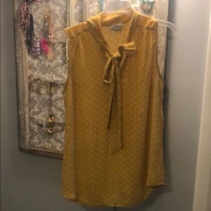 Van Heusen front tie sleeveless blouse.